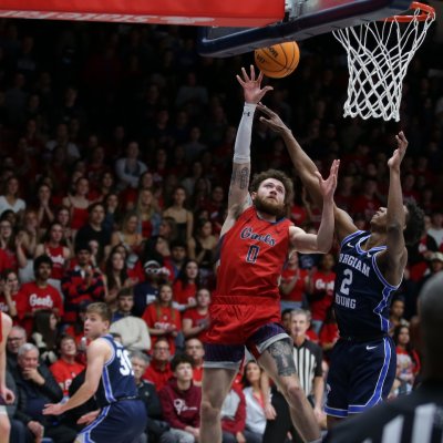 Basketball player Logan Johnson shoots against BYU on February 18