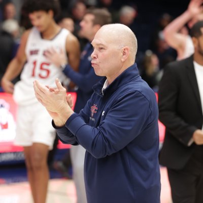 Randy Bennett claps during pregame introductions