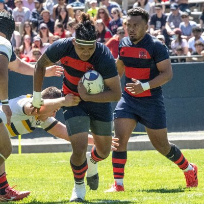 Two Saint Mary's rugby players run against UC Berkeley players on April 15 2023