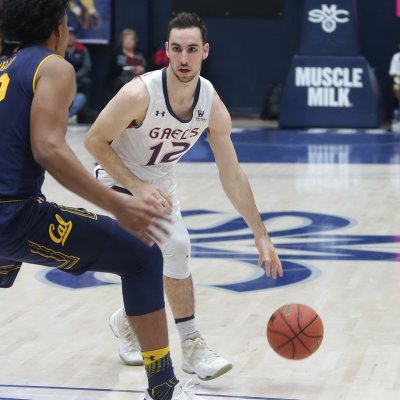Basketball player Tommy Kuhse faces a player from Cal