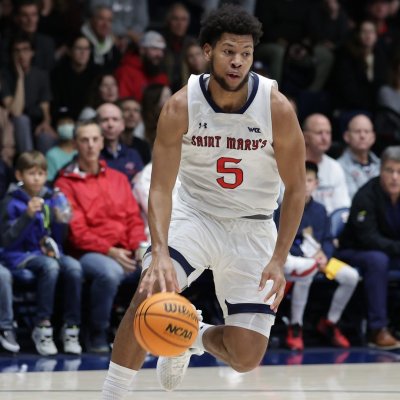 Men's Basketball player Joshua Jefferson drives against Portland in January 2024