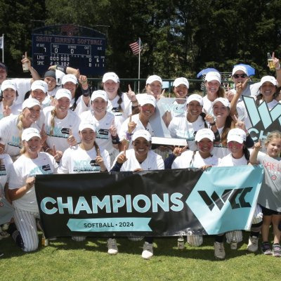 Saint Mary's softball team holding up the West Coast Conference Champions banner