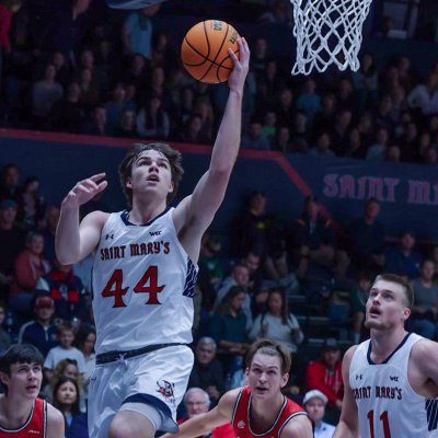 Men's Basketball player Alex Docas, No. 44, goes up for a basket against Davidson in November 2023