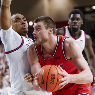 Men's basketball player Mitchell Saxen drives against Gonzaga in February 2025