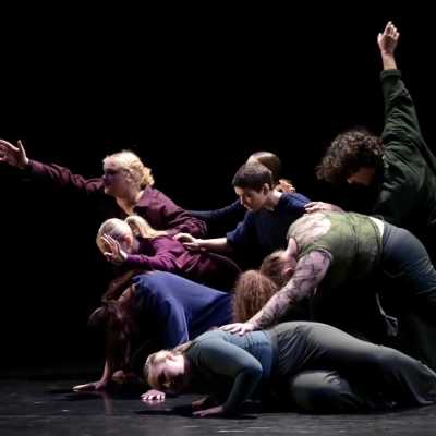 Dancers onstage rehearsing for performance of piece by Erica Hardy in 2025