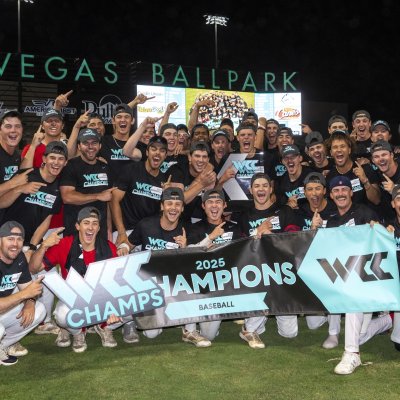 SMC Baseball team with WCC Championship banner in May 2025