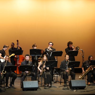SMC Jazz Band performing on stage dressed in formal black.