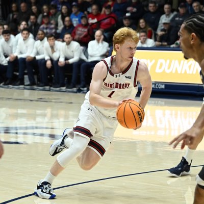 Basketball player Joshua Dent drives against WSU in January 2026