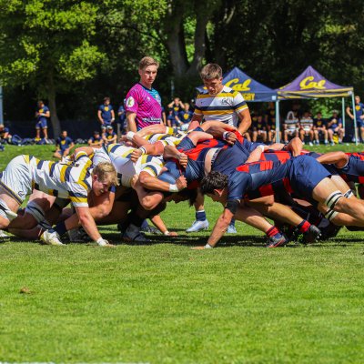 Men's rugby student-athletes from both Saint Mary's and UC Berkeley engage in a rugby scrum.