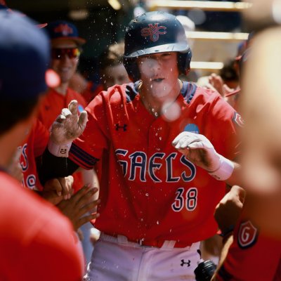 Baseball player Ian Armstrong cheers in dugout as Gaels defeat UCLA on May 31, 2026