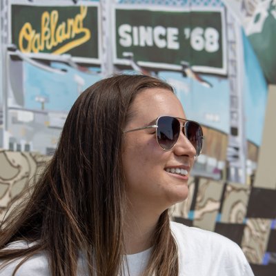 Mia Franceschi poses by Ballers mural at Raimondi Stadium