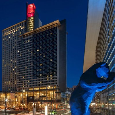 Wide, exterior shot of Denver Hyatt at night