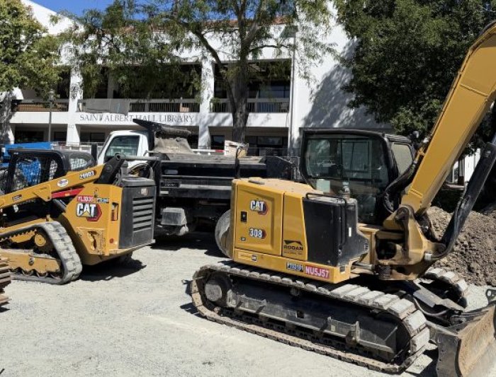 Large construction equipment outside of the library 
