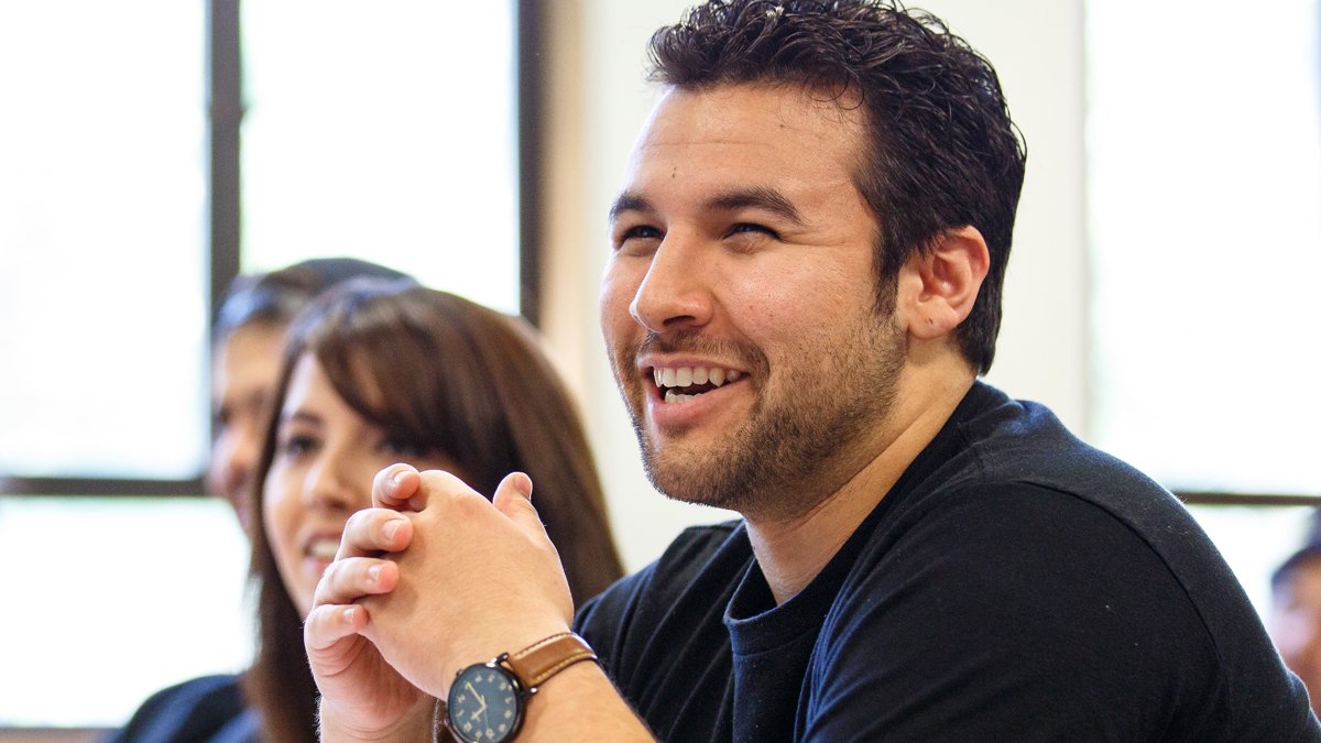 A student laughing in a business class