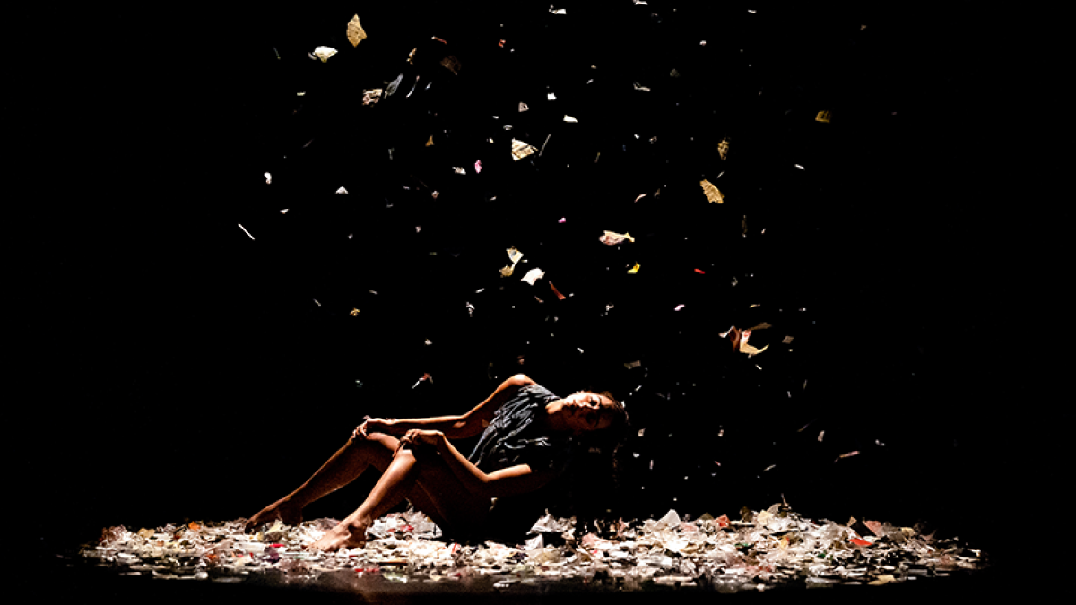 Dancer with confetti falling on stage
