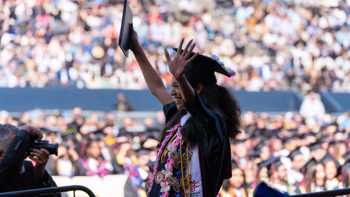 A student celebrating at graduation